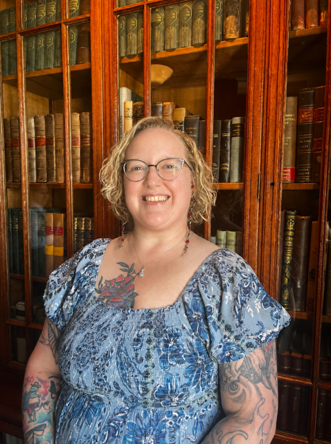 Lindsay Klug standing inside a historic library